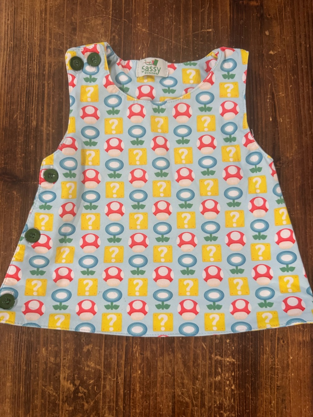 Stitches Light Blue Bib Smock with Red Mushroom & Yellow Blocks